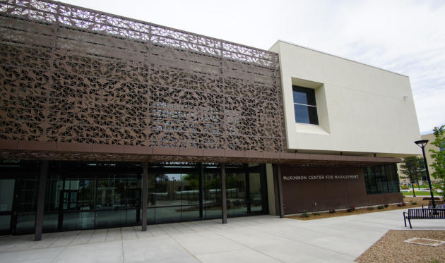 The exterior of the four-story building is a simple material palette of stucco and pre-weathered steel. Custom designed metal screens and canopies add some visual interest and protection from the sun’s glare and heat. (Adolphe Pierre-Louis/Albuquerque Journal)